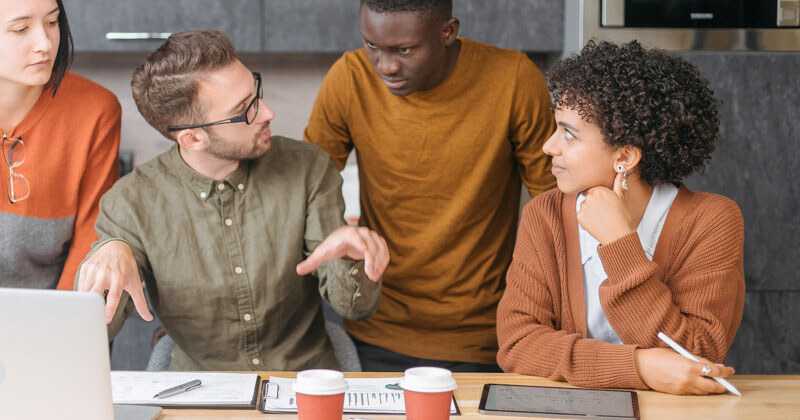 business-man-explaining-something-his-colleagues