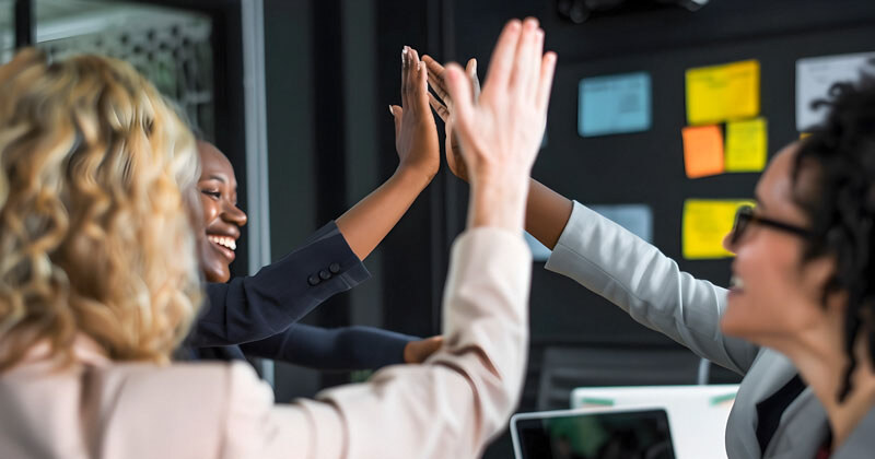 businesswoman-giving-high-five-colleague