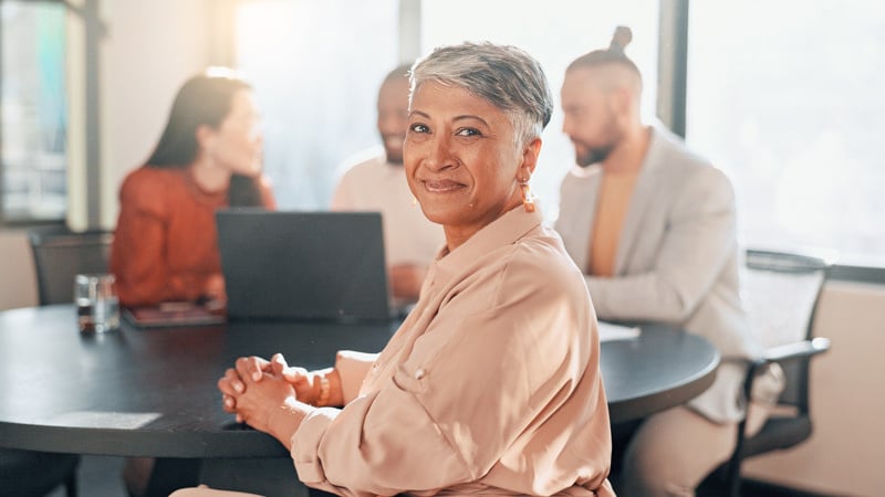 happy-woman-portrait-business-meeting-with-team-management-staff-office-workshop-partnership-startup-success-smile-motivation-mature-manager-collaboration-with-workers