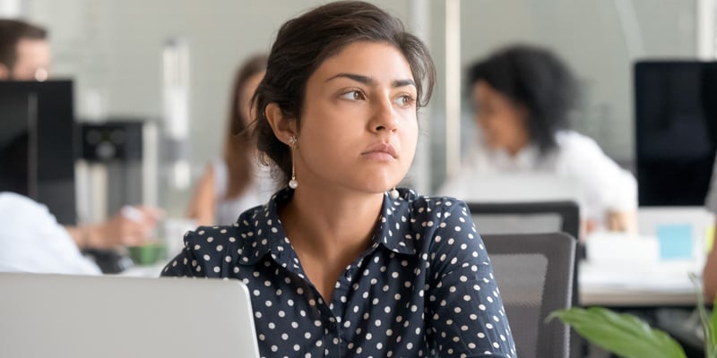 thoughtful-indian-business-woman-looking-away-feeling-bored-pensive-thinking-problem-solution-office-with-laptop-serious-hindu-employee-searching-new-ideas-work-unmotivated-about-dull-job