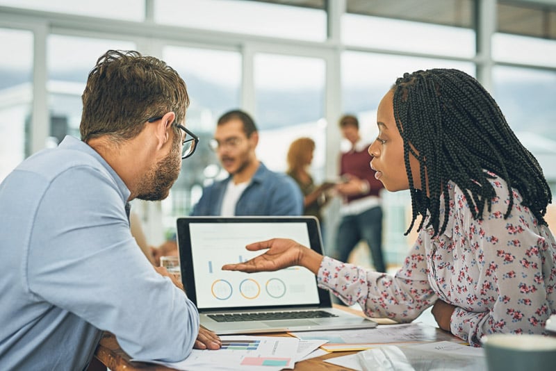 laptop-finance-chart-with-business-team-doing-research-together-their-office-planning-computer-data-graph-with-man-employee-woman-colleague-meeting-discuss-strategy-2